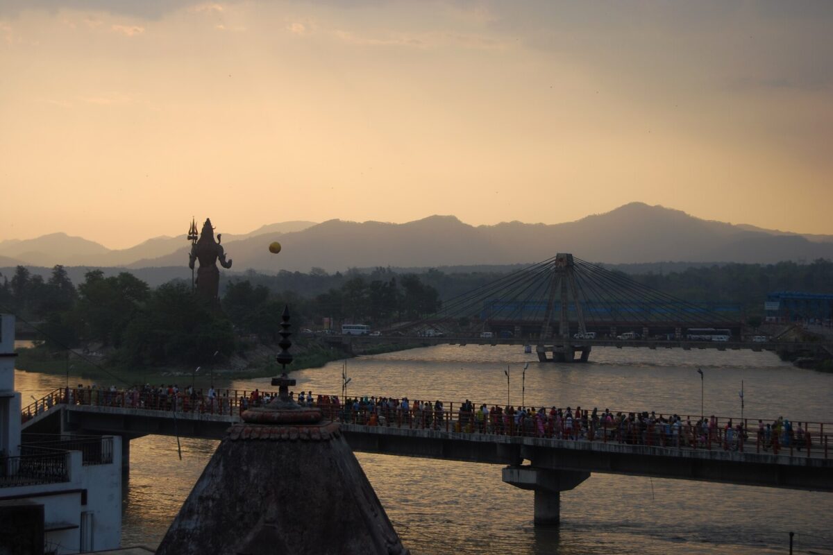 The Ganga flowing through Rishikesh with the Himalayan foothills behind